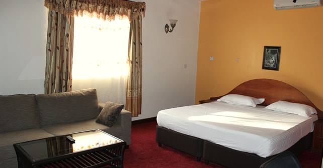 VIP Ensuite room with king bed and sofa